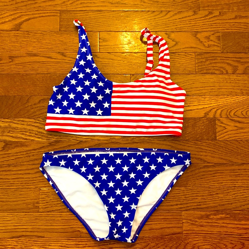 Size medium stars, and stripes bikini. Only worn a handful of times for holidays